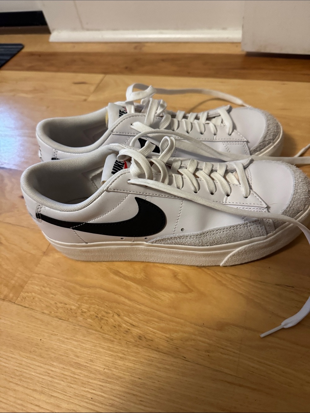 Nike women’s white and black low-top sneakers